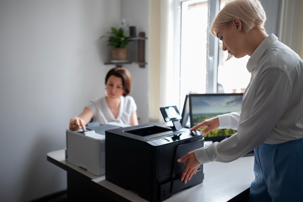 women-work-office-using-printer